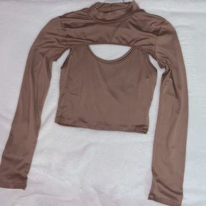 A mock-neck long-sleeve two-piece crop top attached with a tank top tee.